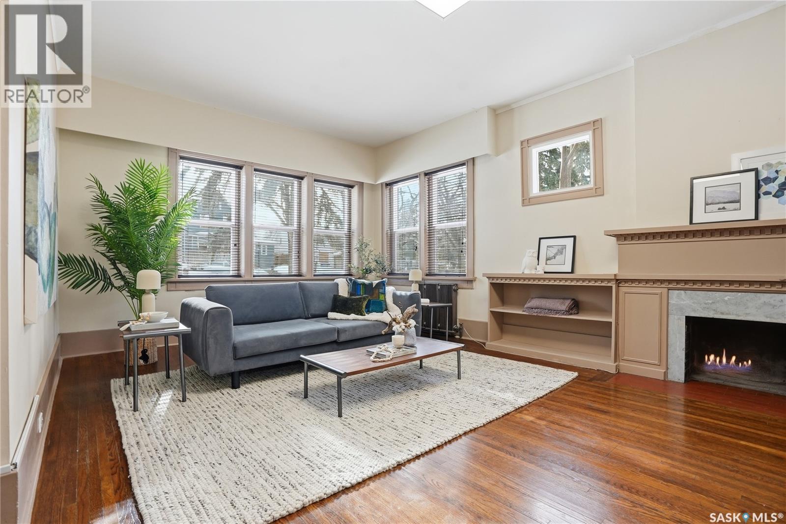 1213 Elliott Street, Saskatoon, SK - Indoor Photo Showing Living Room With Fireplace