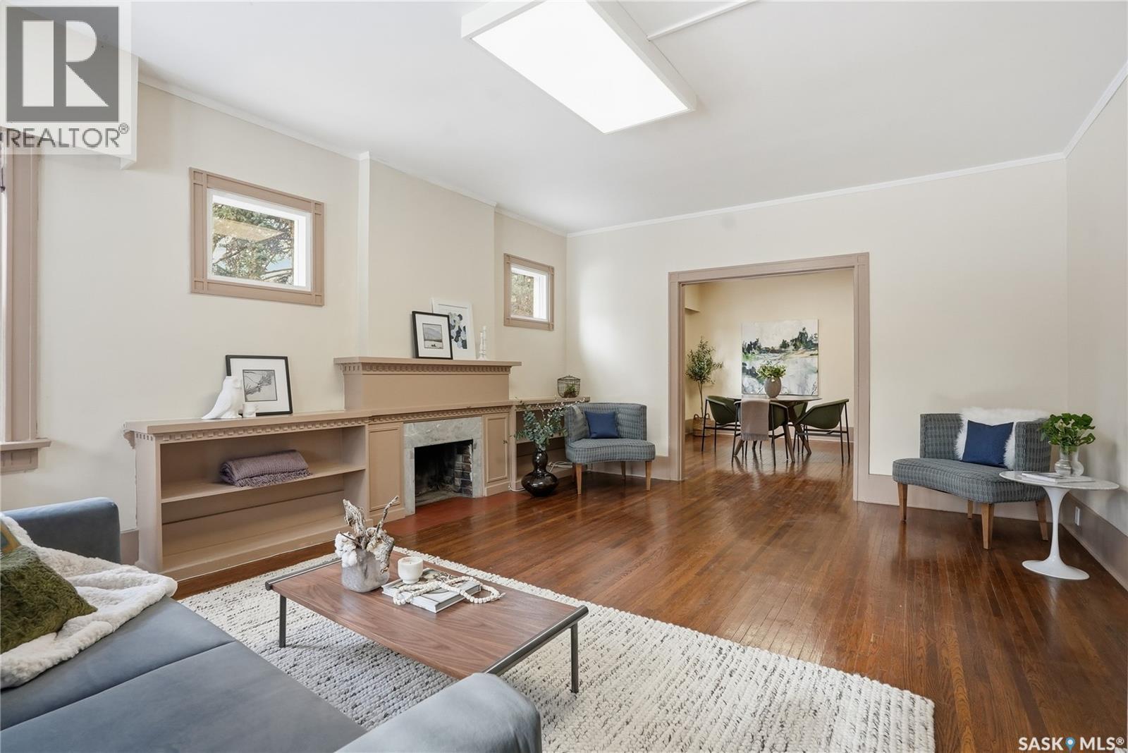 1213 Elliott Street, Saskatoon, SK - Indoor Photo Showing Living Room With Fireplace