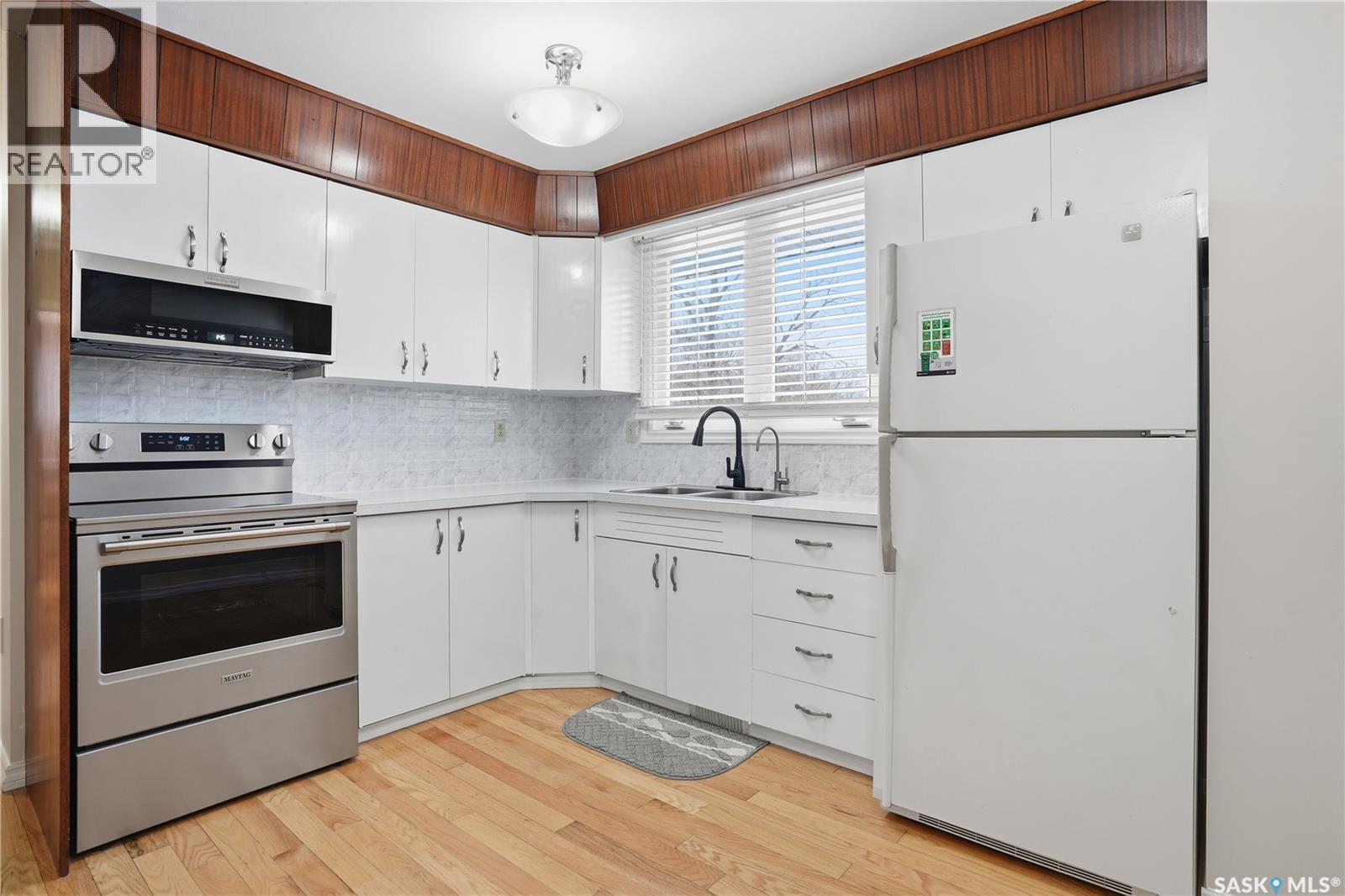 46 Lyons Street, Regina, SK - Indoor Photo Showing Kitchen With Double Sink