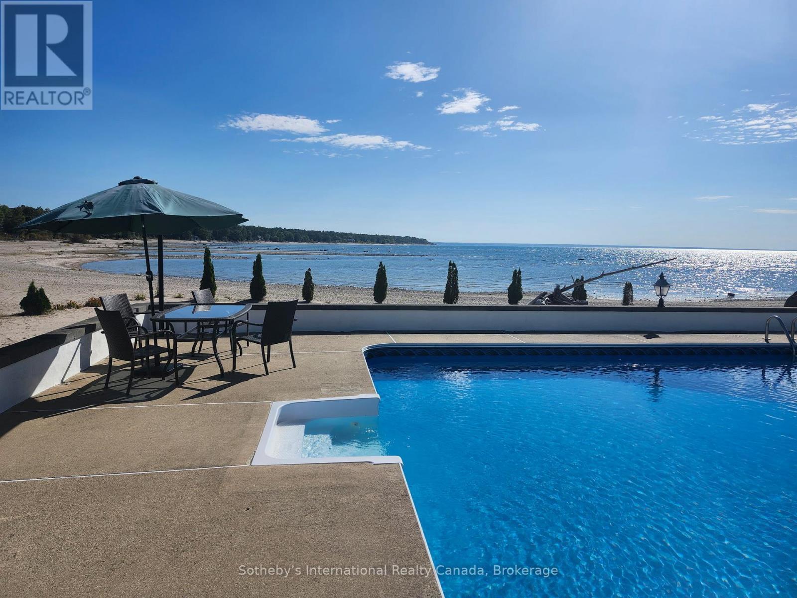 Waterfront beach living... - 1420 Tiny Beaches Road N, Tiny, ON - Outdoor With Body Of Water With In Ground Pool With View