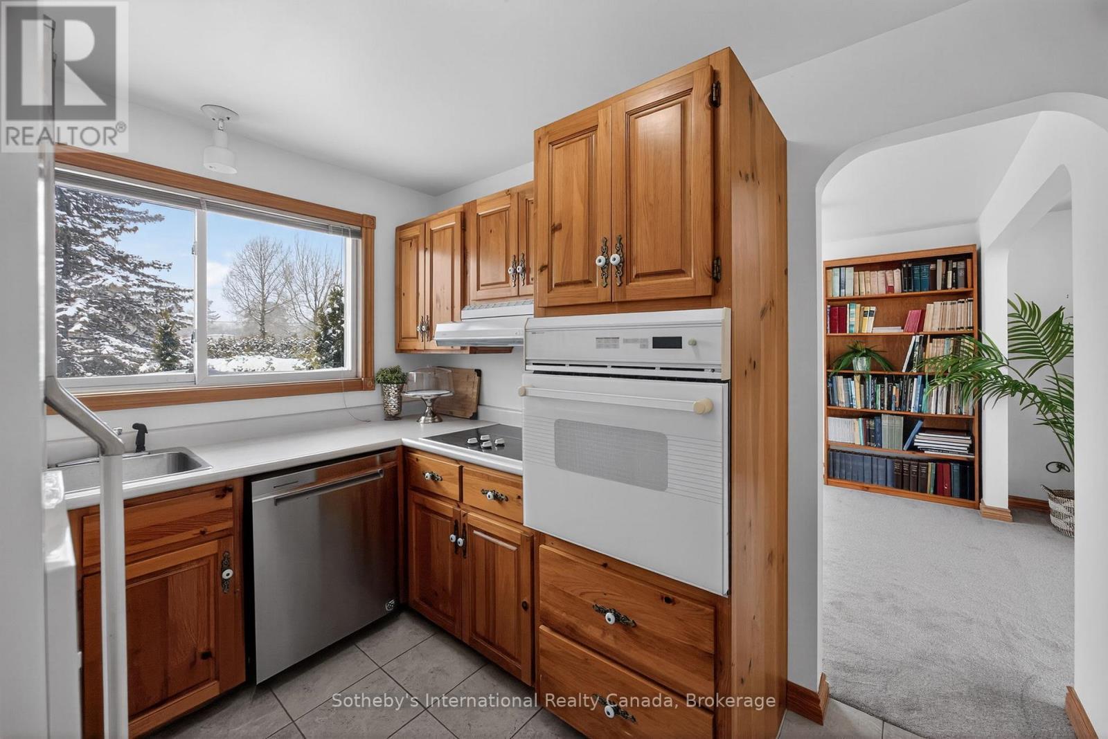 Main level kitchen with built-in wall oven - 1420 Tiny Beaches Road N, Tiny, ON - Indoor Photo Showing Kitchen