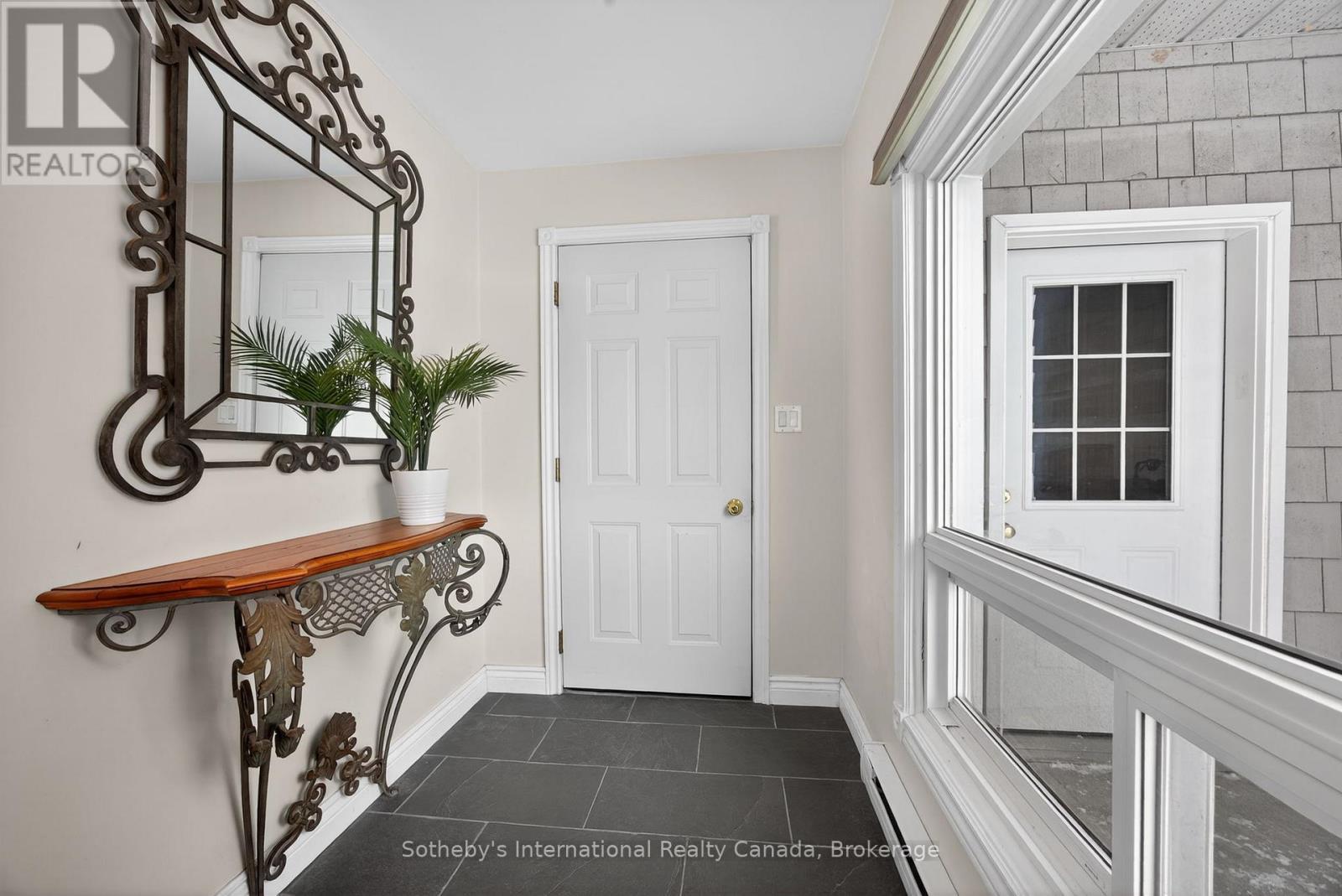 In-between level foyer directly off the garage - 1420 Tiny Beaches Road N, Tiny, ON - Indoor Photo Showing Other Room