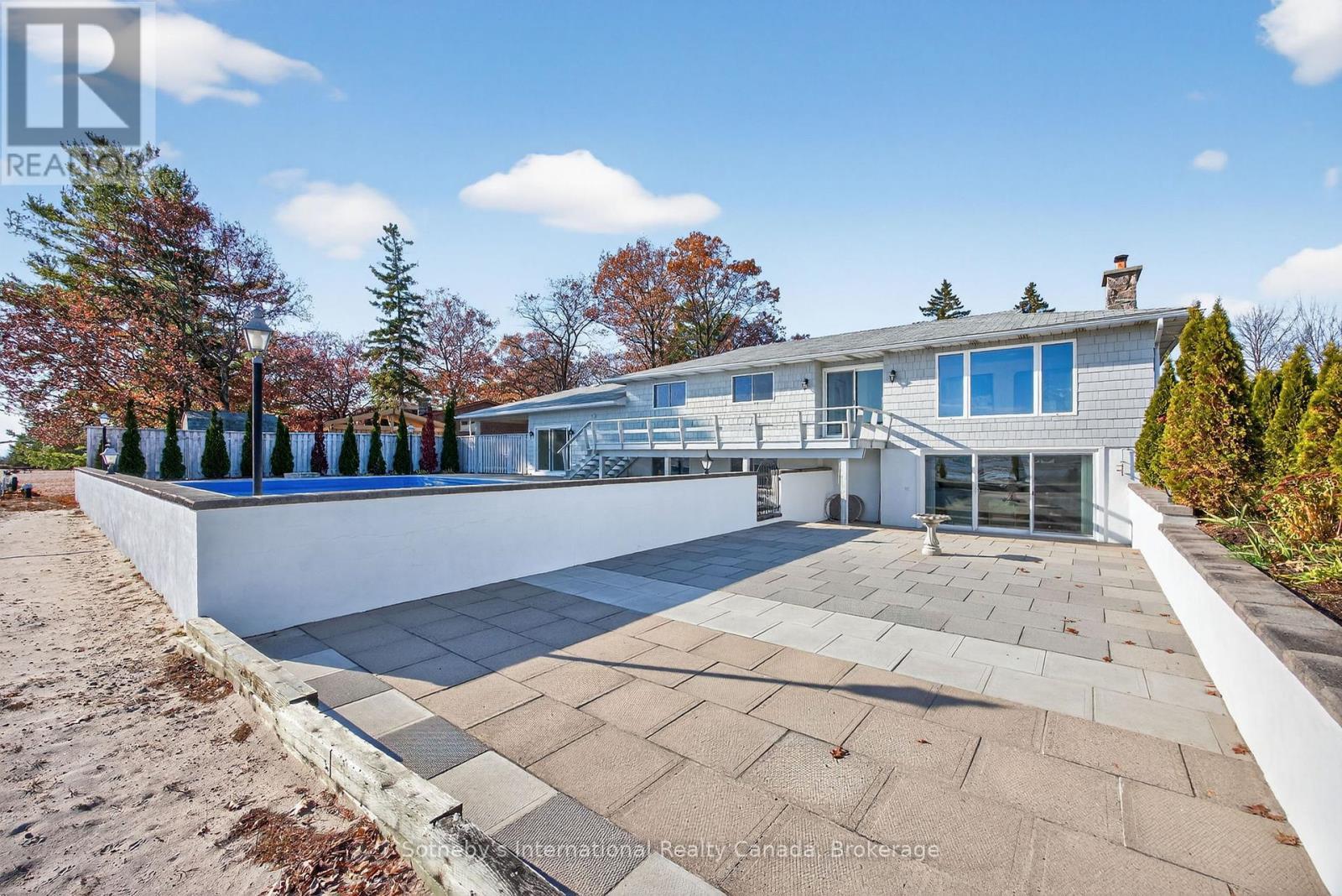 Walk-out from the lower level to the beach & pool - 1420 Tiny Beaches Road N, Tiny, ON - Outdoor