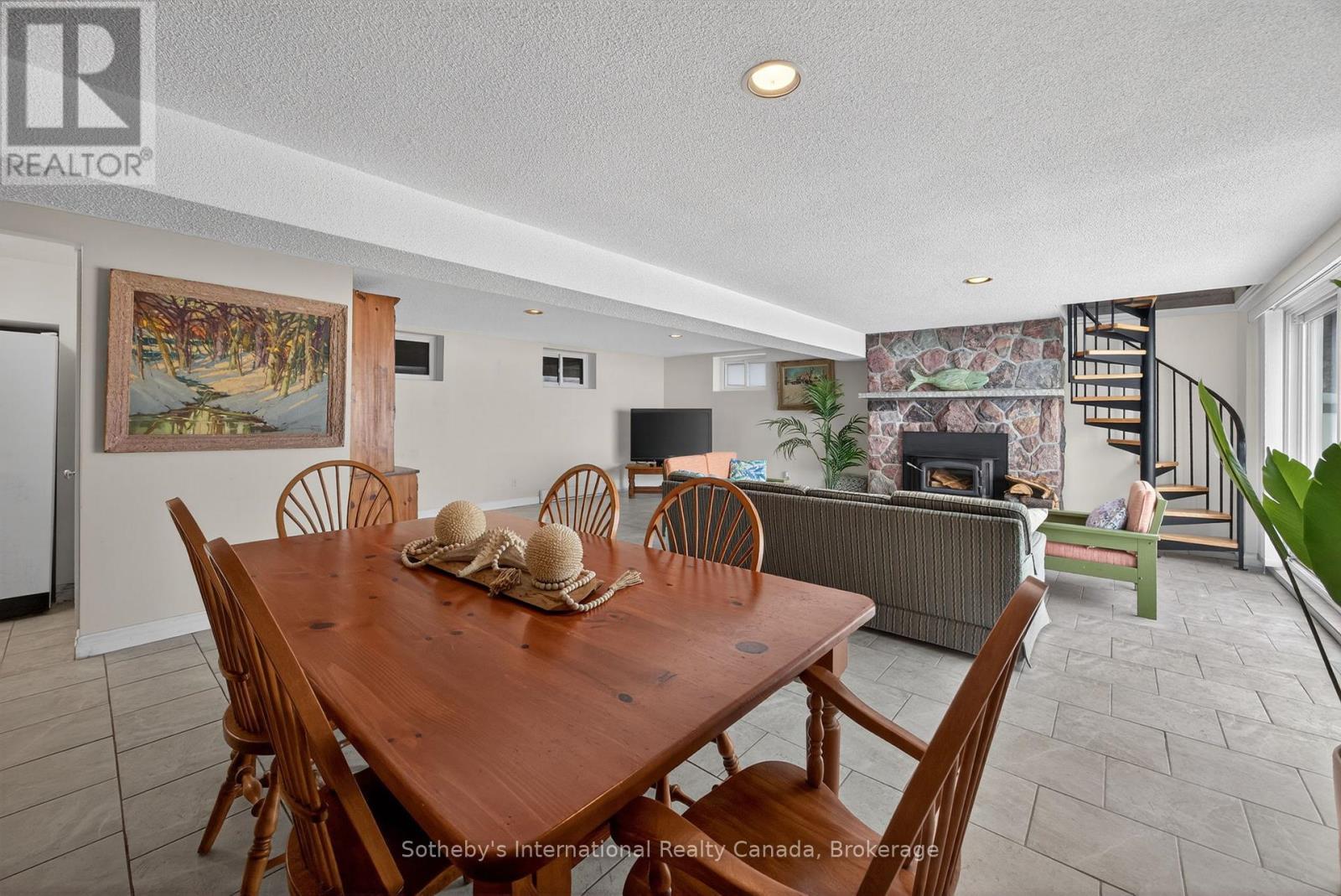 Lower level Great Room space - 1420 Tiny Beaches Road N, Tiny, ON - Indoor Photo Showing Dining Room With Fireplace
