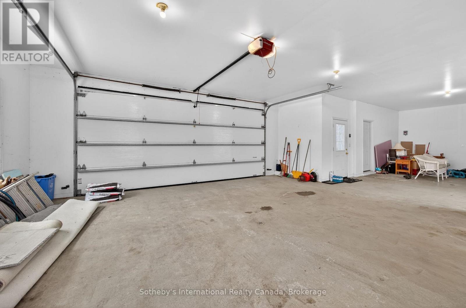 Clean finished garage - 1420 Tiny Beaches Road N, Tiny, ON - Indoor Photo Showing Garage