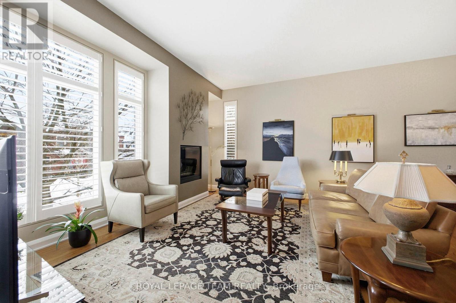418 Mayfair Avenue, Ottawa, ON - Indoor Photo Showing Living Room With Fireplace