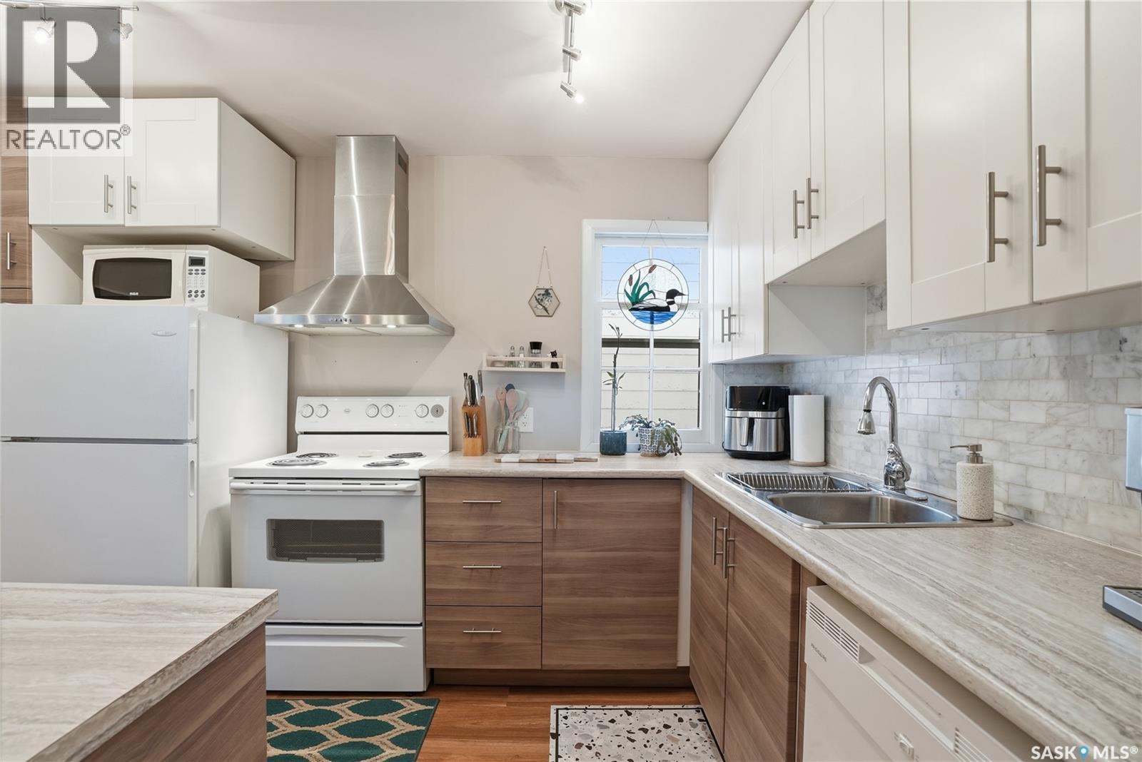 215 Ash Street E, Saskatoon, SK - Indoor Photo Showing Kitchen With Double Sink
