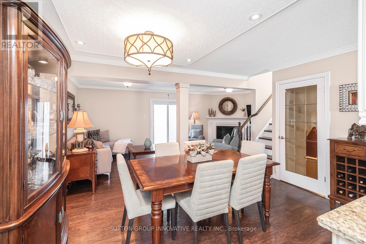 27 Beaverton Drive, Hamilton, ON - Indoor Photo Showing Dining Room With Fireplace