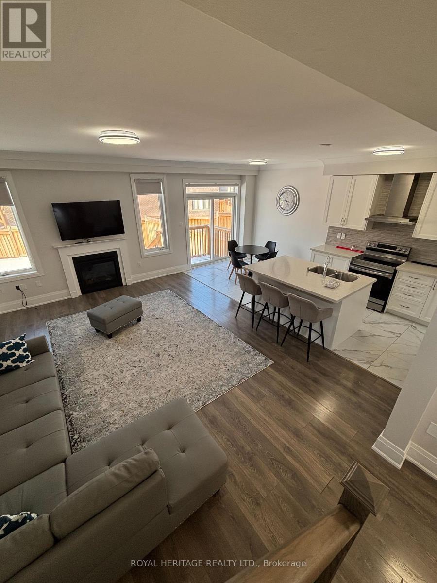 65 Conarty Crescent E, Whitby, ON - Indoor With Fireplace