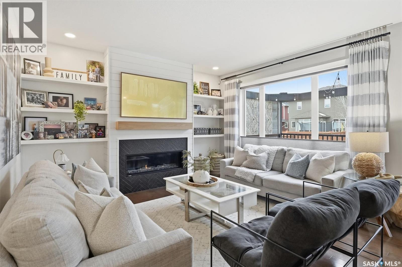 1015 Muzyka Road, Saskatoon, SK - Indoor Photo Showing Living Room With Fireplace