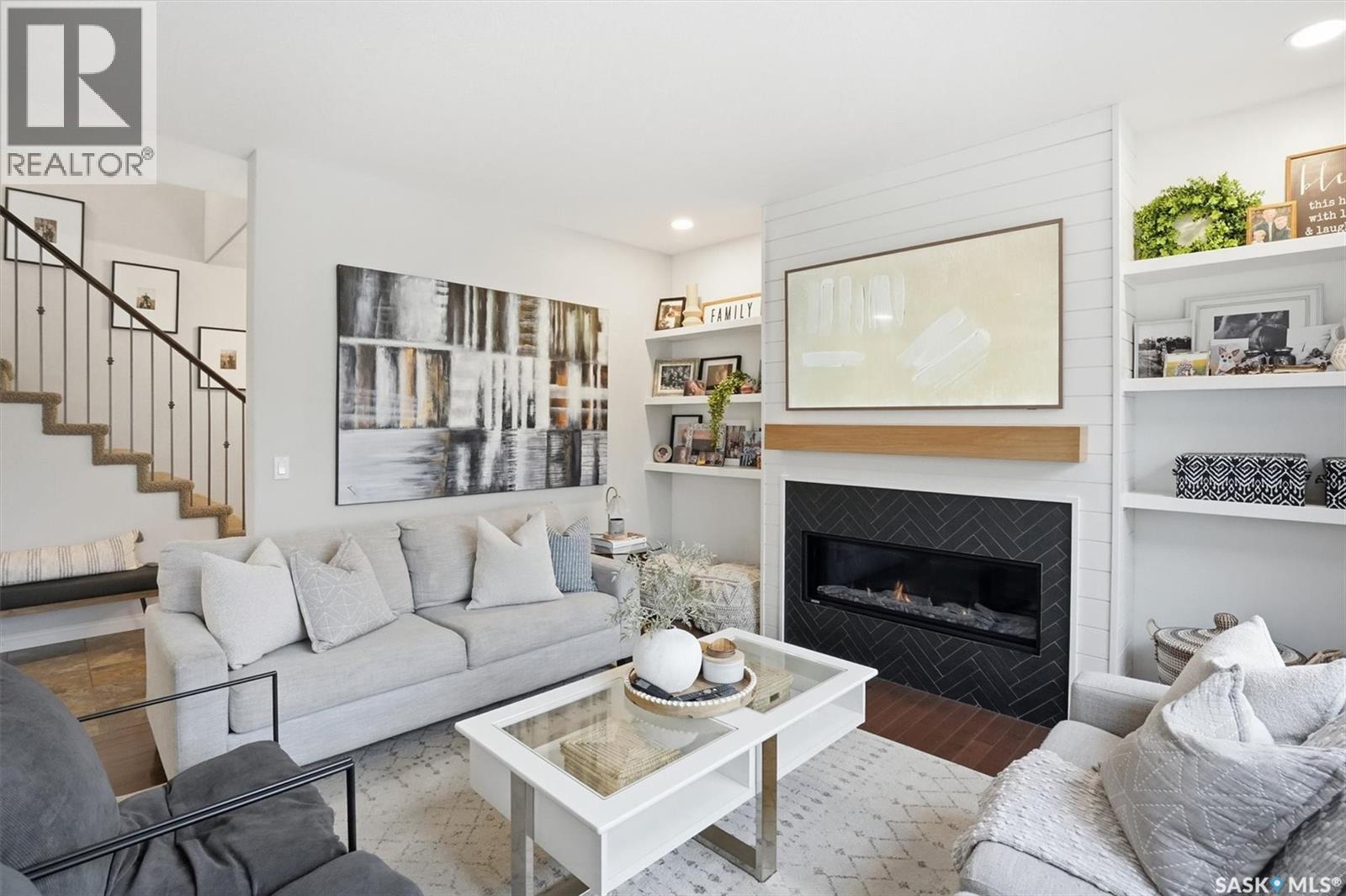 1015 Muzyka Road, Saskatoon, SK - Indoor Photo Showing Living Room With Fireplace