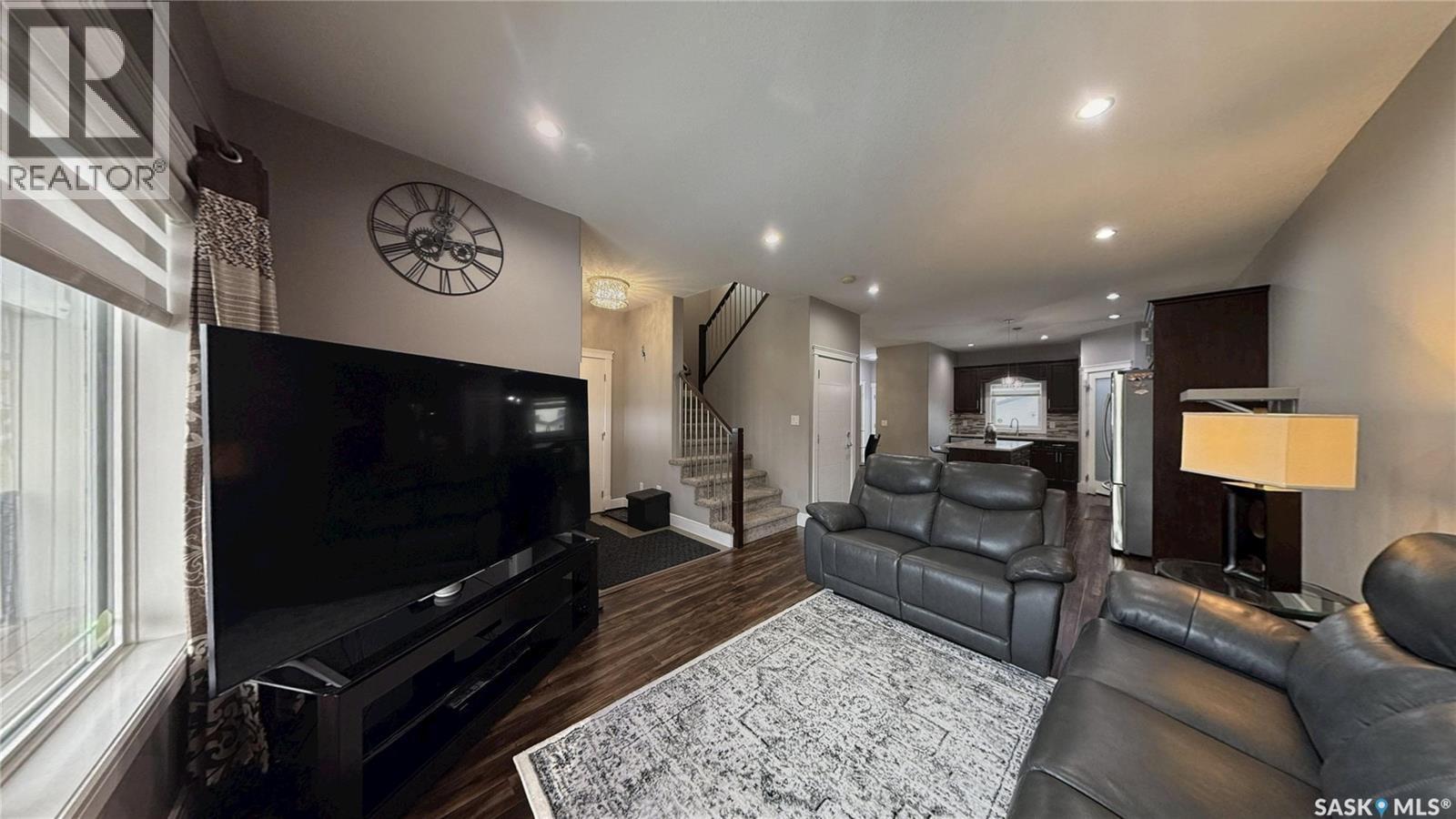 414 Ells Way, Saskatoon, SK - Indoor Photo Showing Other Room With Fireplace