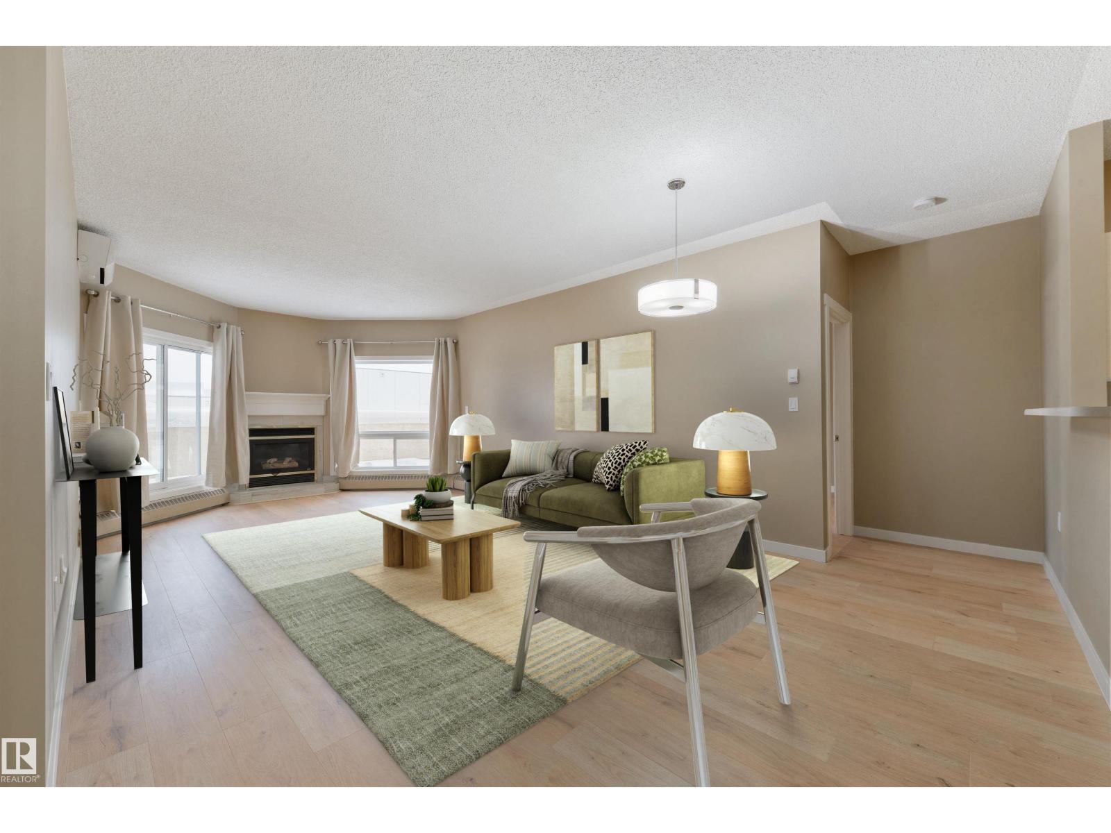 #232 15499 Castle Downs Rd Nw, Edmonton, AB - Indoor Photo Showing Living Room With Fireplace