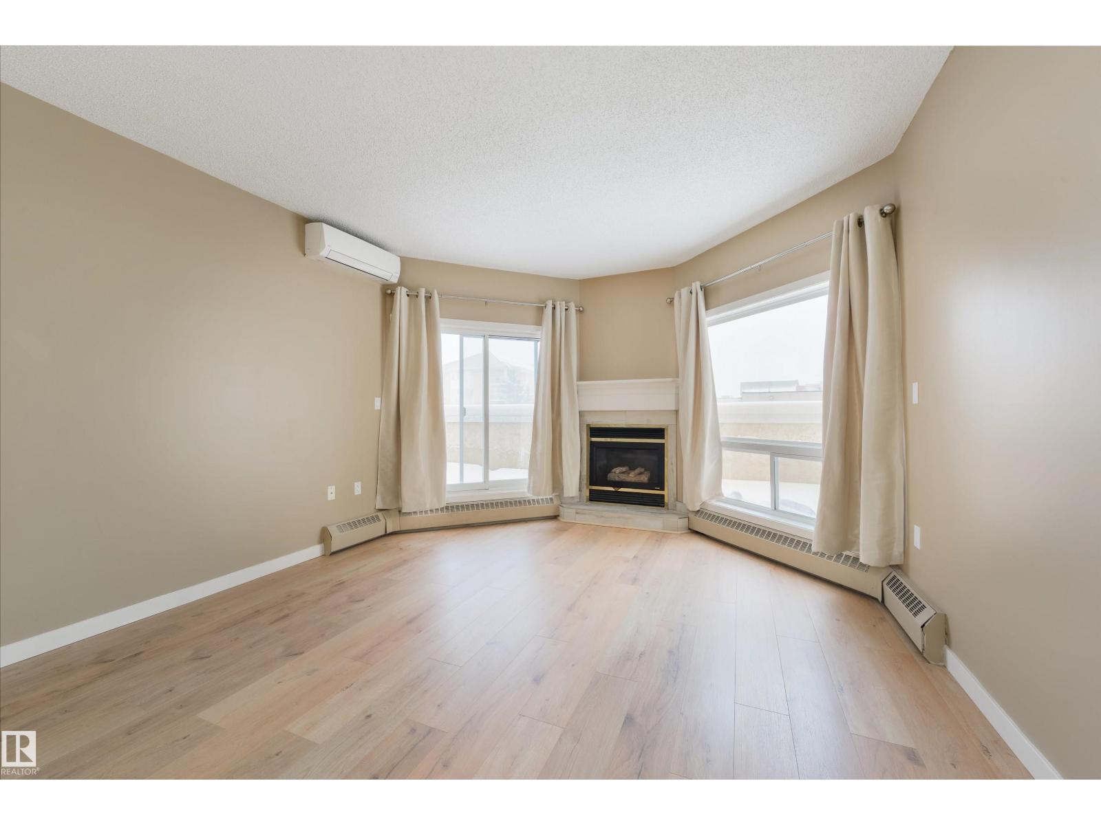#232 15499 Castle Downs Rd Nw, Edmonton, AB - Indoor Photo Showing Living Room With Fireplace