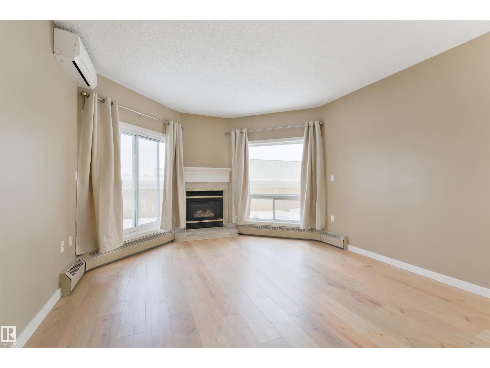 #232 15499 Castle Downs Rd Nw, Edmonton, AB - Indoor Photo Showing Other Room With Fireplace