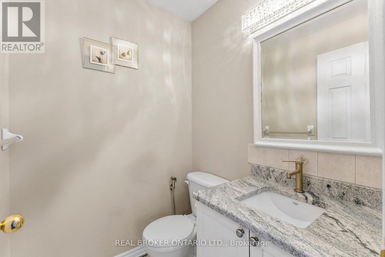 Main level powder room w/ new granite countertop - 2014 Jasper Avenue, Ottawa, ON - Indoor Photo Showing Bathroom