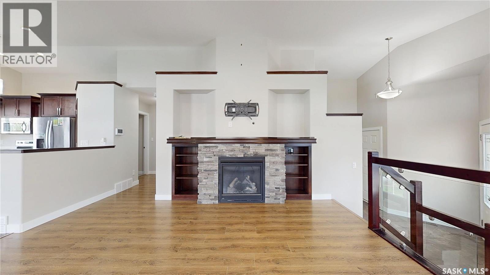 5614 Beacon Place, Regina, SK - Indoor Photo Showing Living Room With Fireplace