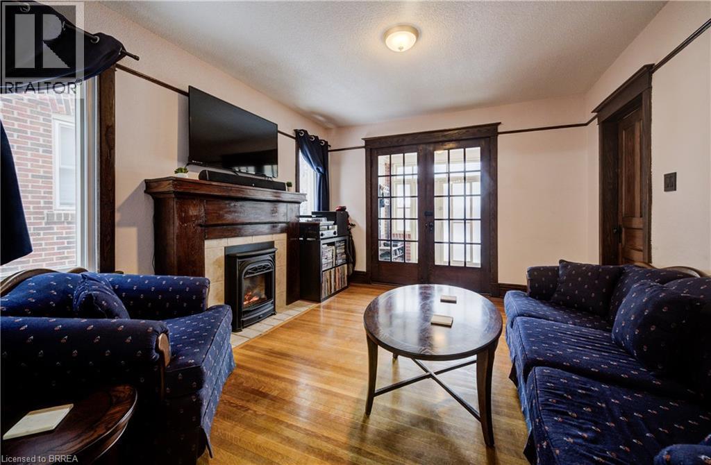 48 Longwood Road N, Hamilton, ON - Indoor Photo Showing Living Room With Fireplace