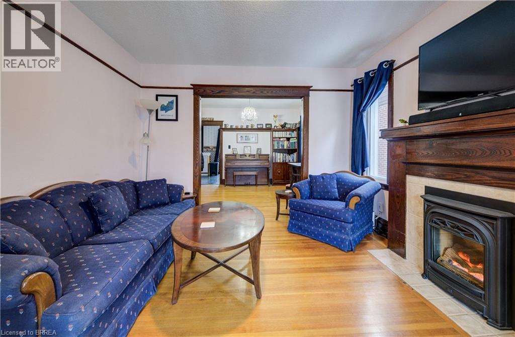 48 Longwood Road N, Hamilton, ON - Indoor Photo Showing Living Room With Fireplace