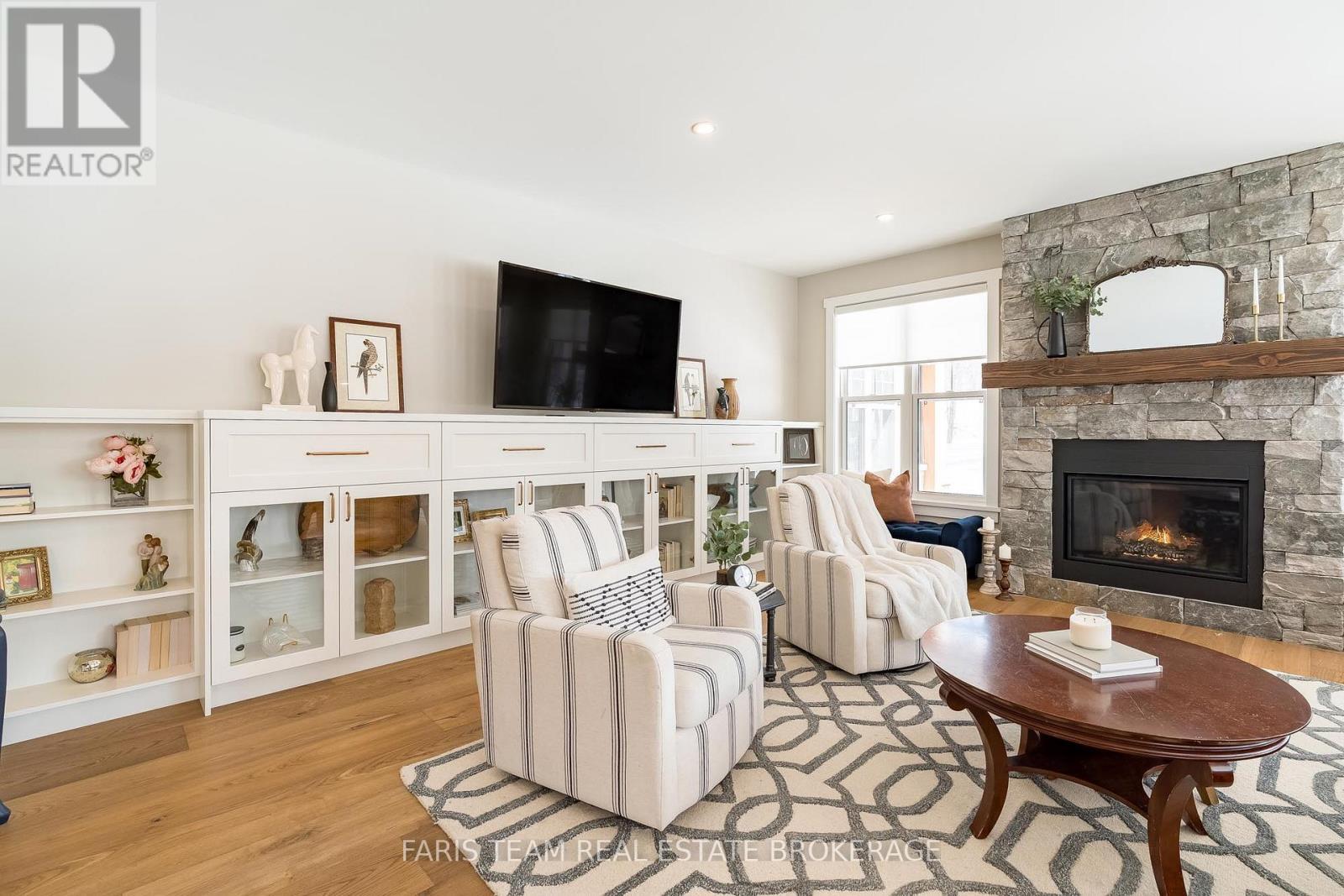 1555 Baseline Road S, Tiny, ON - Indoor Photo Showing Living Room With Fireplace