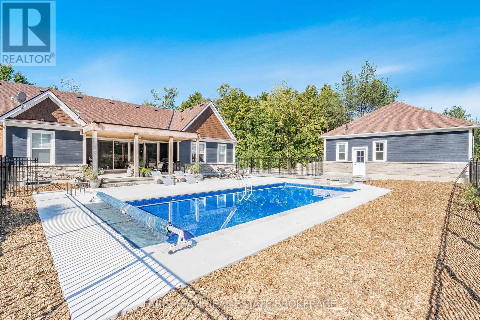 1555 Baseline Road S, Tiny, ON - Outdoor With In Ground Pool With Deck Patio Veranda