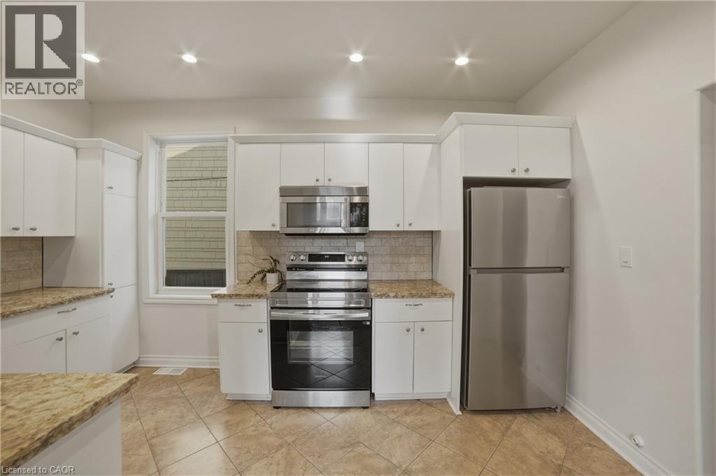 Stainless steel fridge & stove (2024) - 81 Ottawa Street N, Hamilton, ON - Indoor Photo Showing Kitchen With Stainless Steel Kitchen