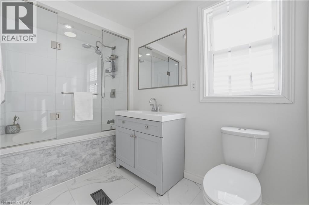 Soaker tub & 12x24 ceramic tiles - 81 Ottawa Street N, Hamilton, ON - Indoor Photo Showing Bathroom