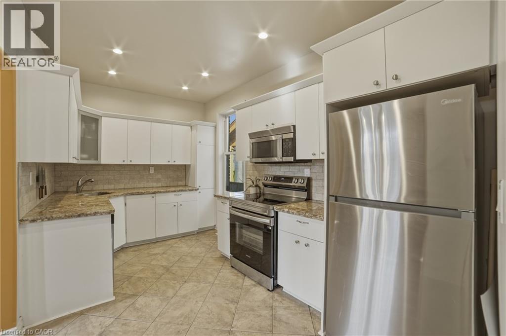 Stainless steel fridge & stove (2024) - 81 Ottawa Street N, Hamilton, ON - Indoor Photo Showing Kitchen With Stainless Steel Kitchen