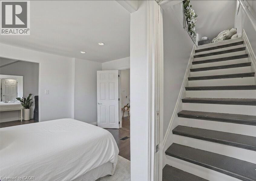 Primary bedroom with loft access. - 81 Ottawa Street N, Hamilton, ON - Indoor Photo Showing Bedroom