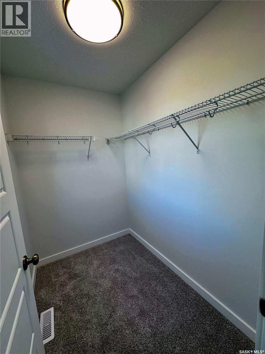 5457 Buckingham Drive E, Regina, SK - Indoor With Storage