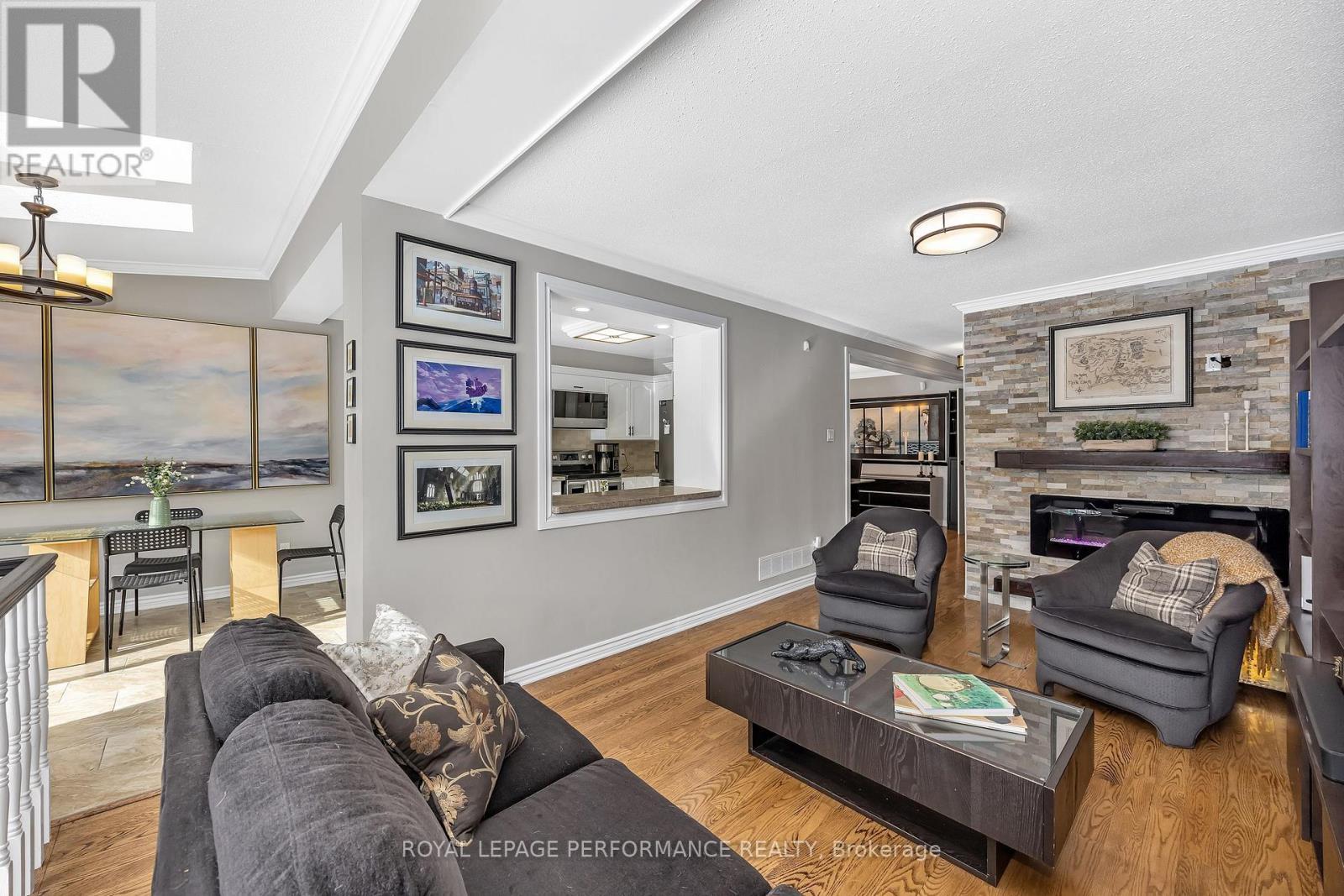 81 Saddle Crescent, Ottawa, ON - Indoor Photo Showing Living Room With Fireplace