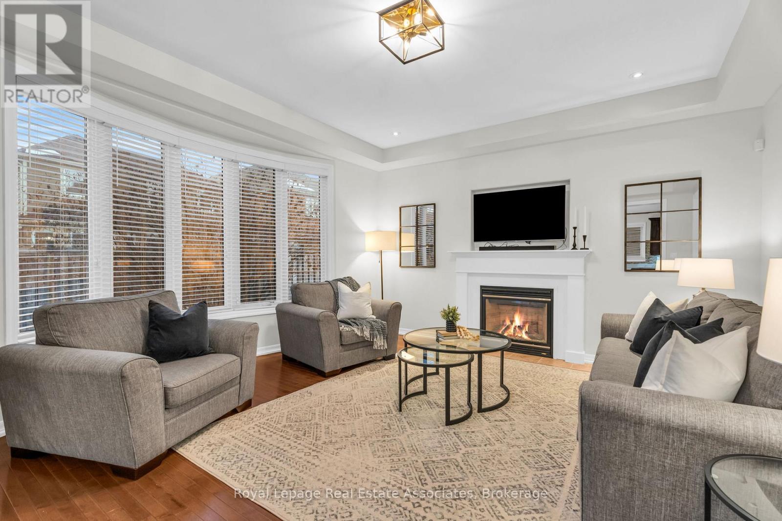 879 Etherington Way, Milton, ON - Indoor Photo Showing Living Room With Fireplace