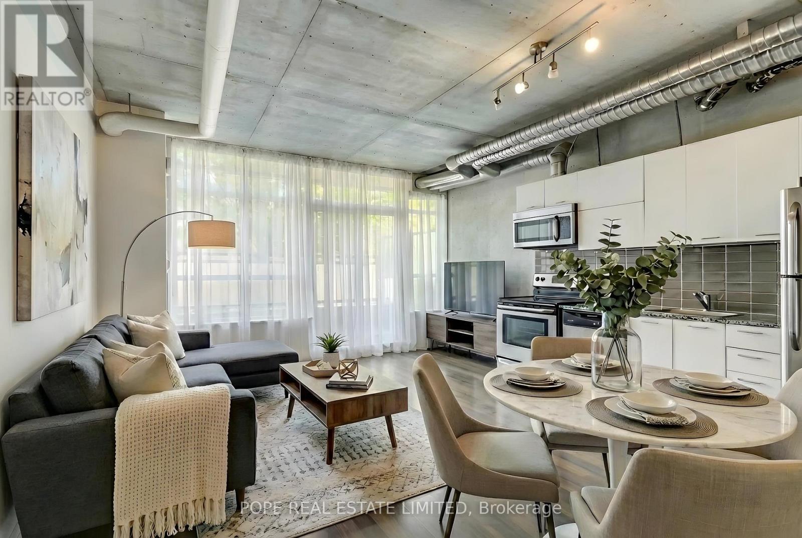 Virtual Staging - Living/Dining/Kitchen - 312 - 38 Joe Shuster Way, Toronto, ON - Indoor Photo Showing Dining Room