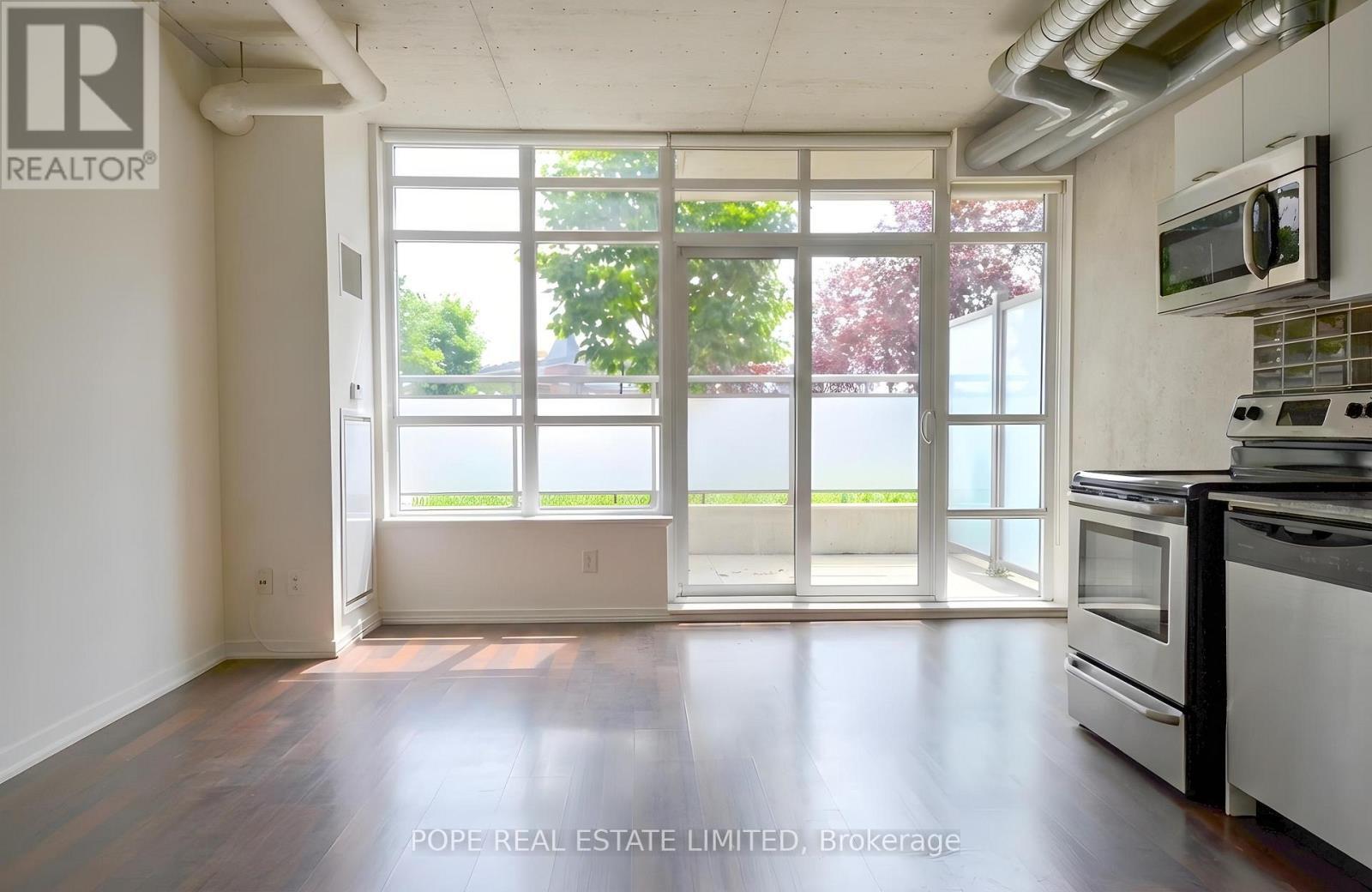 Living Room 1 - 312 - 38 Joe Shuster Way, Toronto, ON - Indoor Photo Showing Kitchen