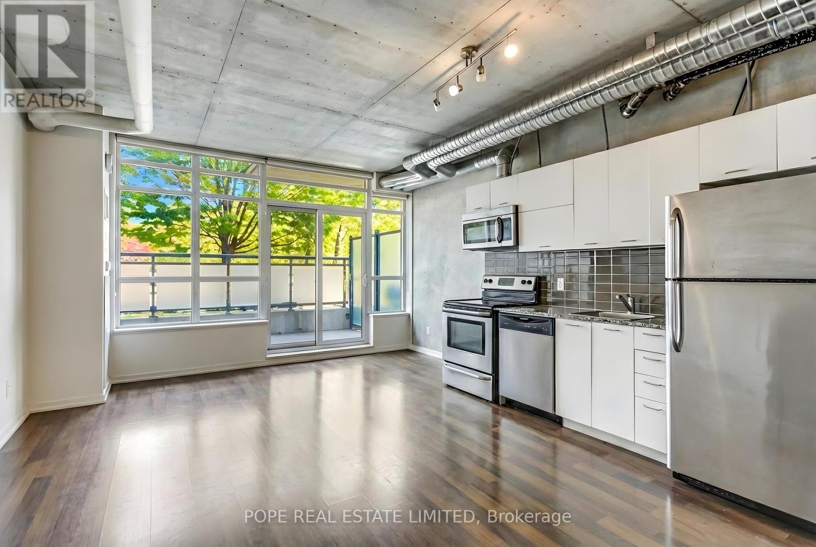 Living Room 2 - 312 - 38 Joe Shuster Way, Toronto, ON - Indoor Photo Showing Kitchen With Stainless Steel Kitchen