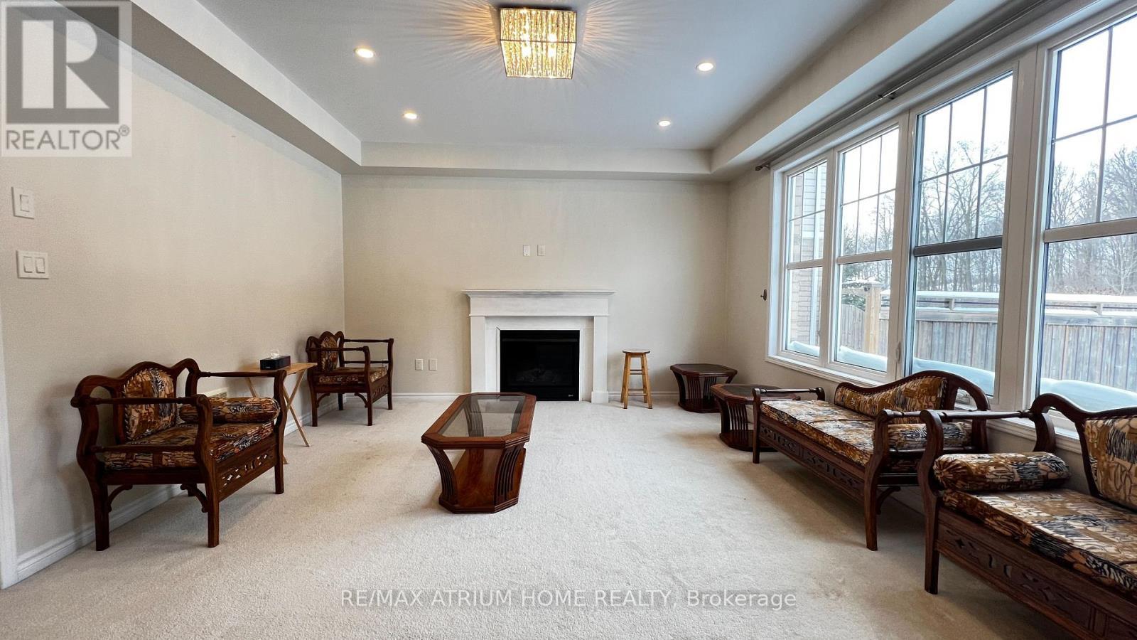 Family Room - 2 Forest Grove Lane, Kitchener, ON - Indoor With Fireplace