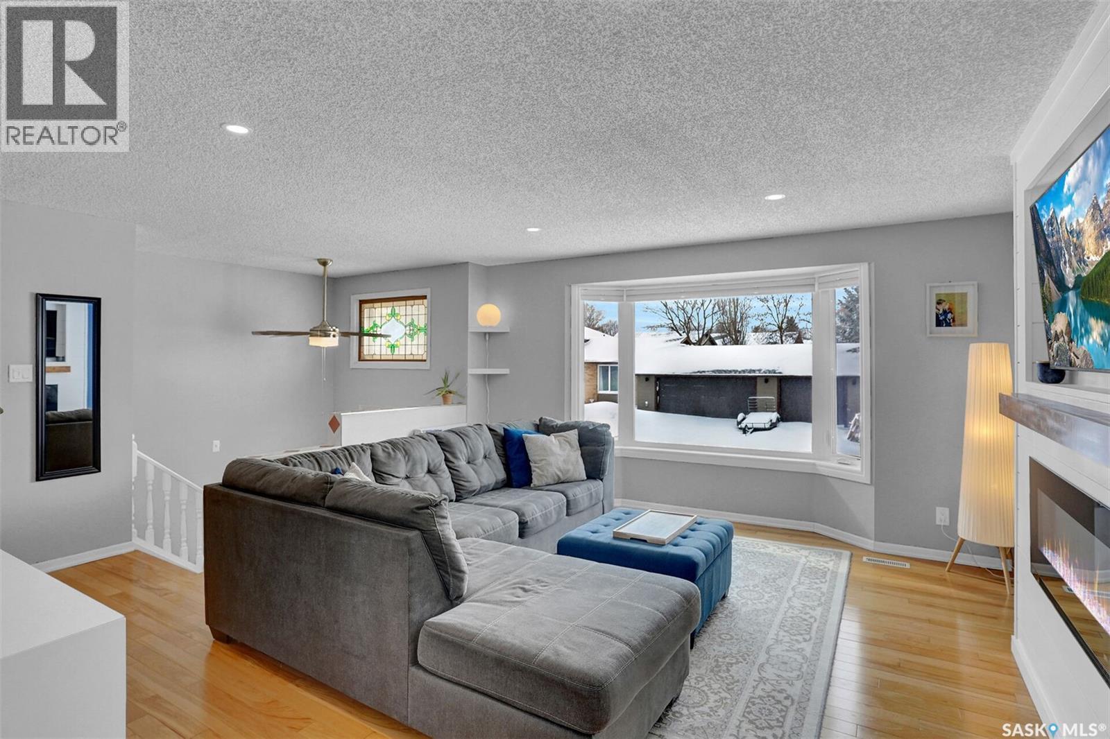 1245 Runciman Crescent N, Regina, SK - Indoor Photo Showing Living Room With Fireplace