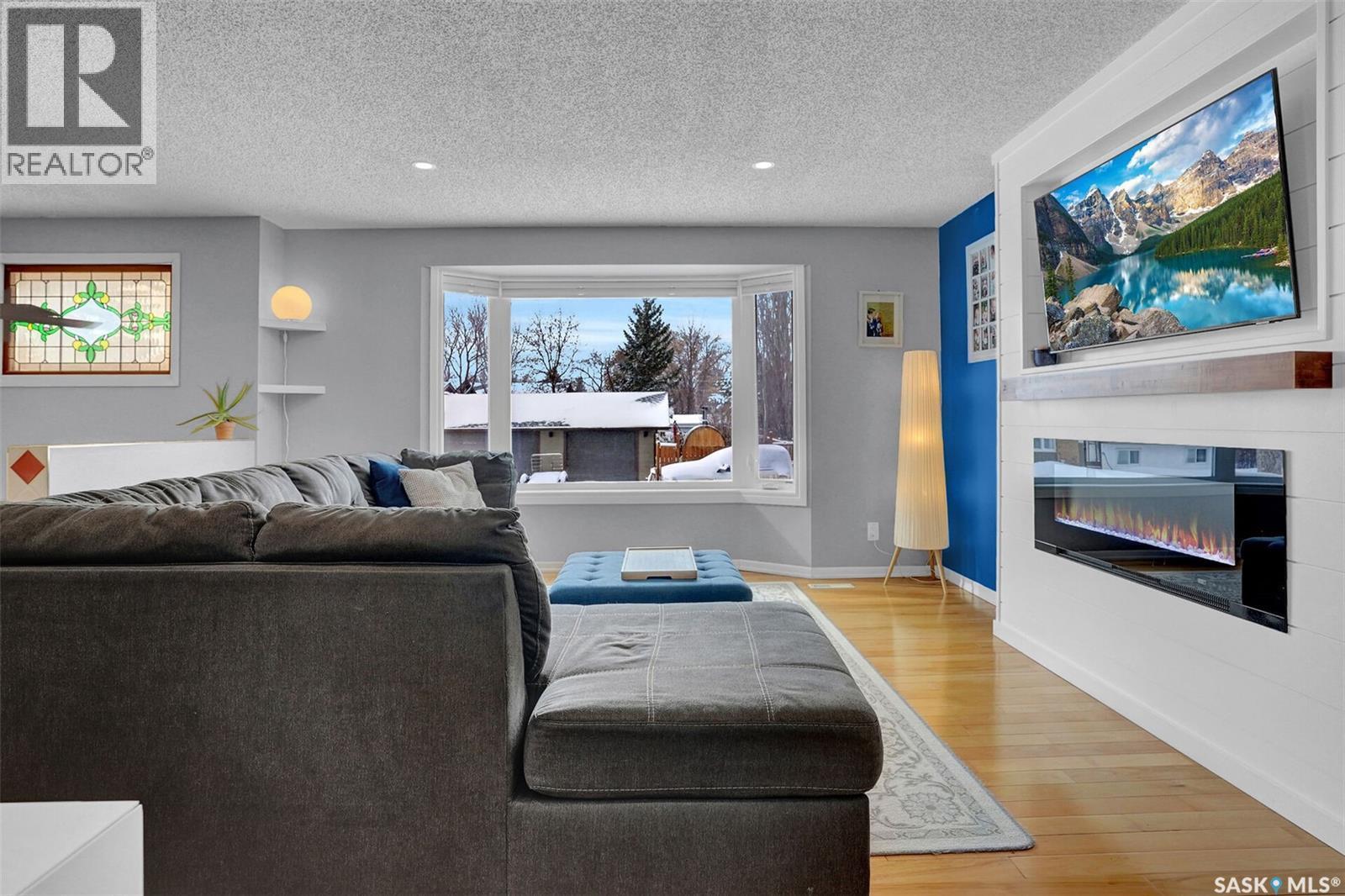 1245 Runciman Crescent N, Regina, SK - Indoor Photo Showing Living Room With Fireplace