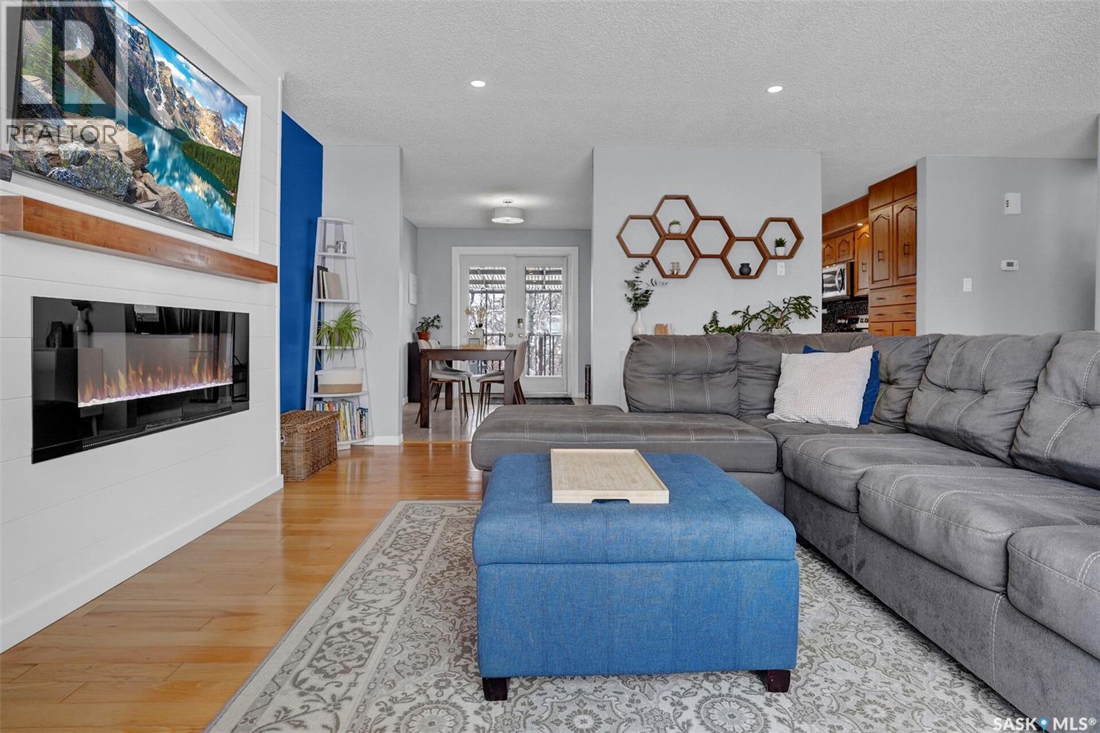 1245 Runciman Crescent N, Regina, SK - Indoor Photo Showing Living Room With Fireplace