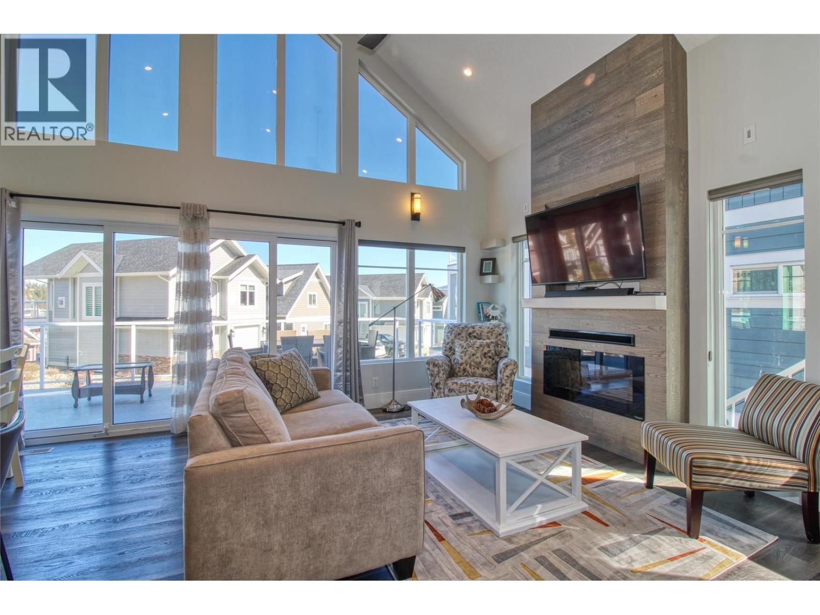6742 Marbella Loop Unit# 302, Kelowna, BC - Indoor Photo Showing Living Room With Fireplace