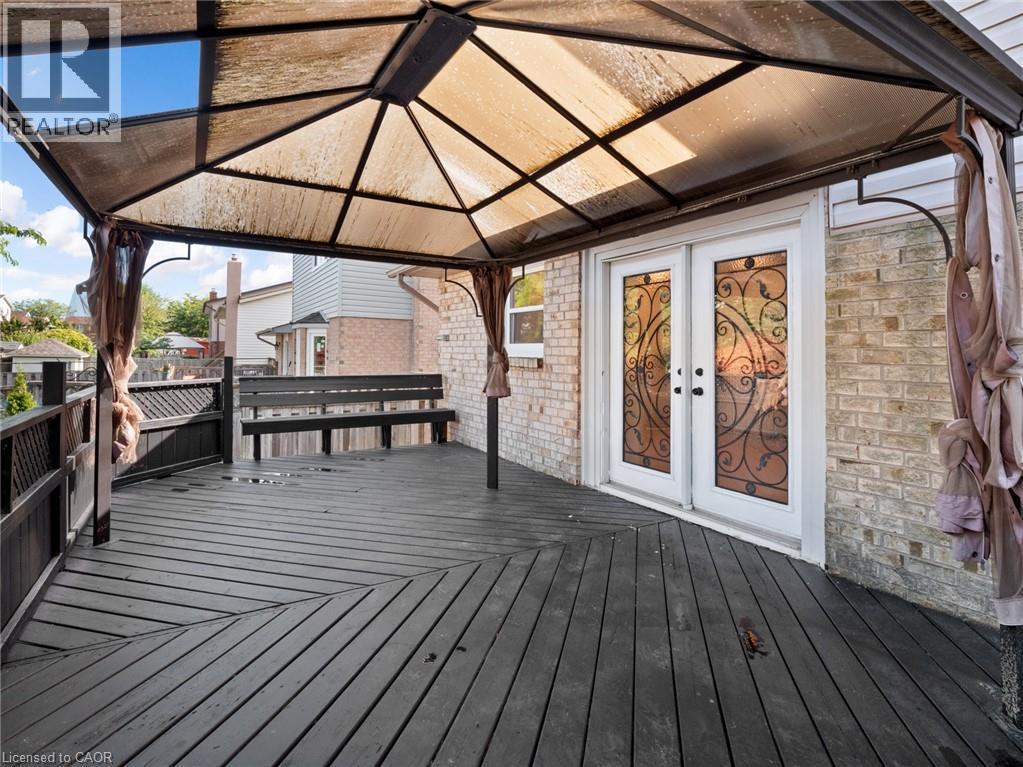 Wooden deck featuring a gazebo and french doors - 24 Keefer Road, Thorold, ON - Outdoor With Deck Patio Veranda With Exterior