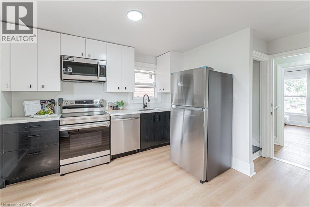 STUNNING Kitchen #2 will impress includes laundry!! - 15 Barnesdale Avenue N, Hamilton, ON - Indoor Photo Showing Kitchen