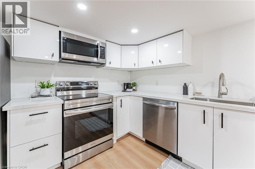 STUNNING Kitchen #3 will impress includes separate laundry area!! - 15 Barnesdale Avenue N, Hamilton, ON - Indoor Photo Showing Kitchen