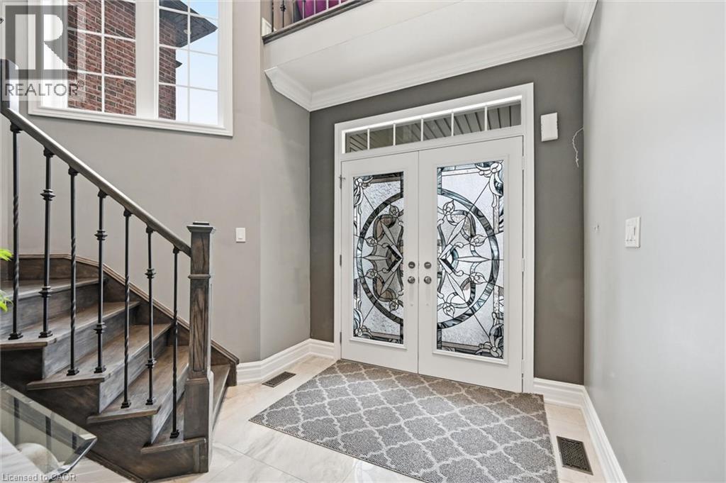 Entryway featuring french doors and ornamental molding - 456 Valridge Drive, Ancaster, ON - Indoor Photo Showing Other Room