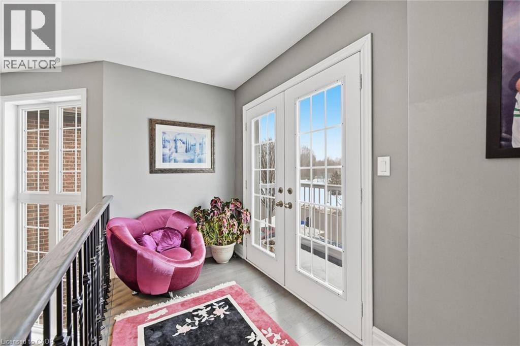 Doorway featuring french doors and wood finished floors - 456 Valridge Drive, Ancaster, ON - Photo Showing Other Room