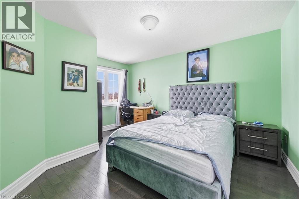 Bedroom with dark wood-type flooring and a textured ceiling - 456 Valridge Drive, Ancaster, ON - Indoor Photo Showing Bedroom
