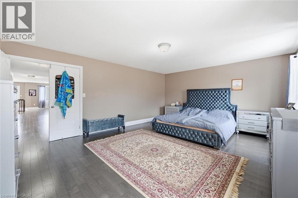 Bedroom with dark wood-type flooring and multiple windows - 456 Valridge Drive, Ancaster, ON - Indoor Photo Showing Bedroom