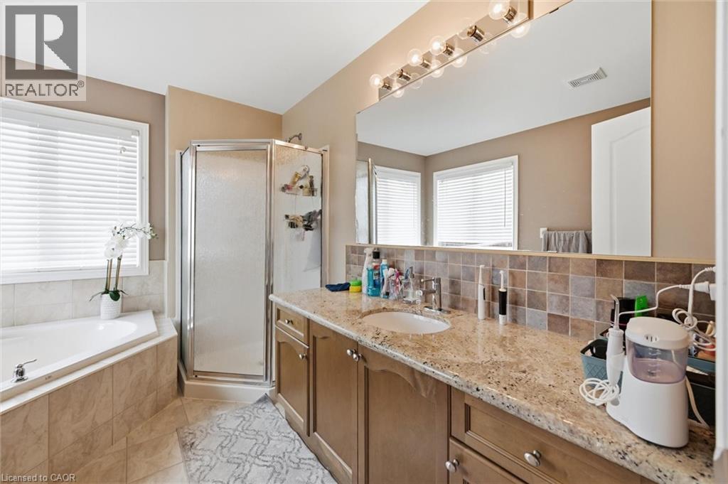 Bathroom with vanity, a shower stall, a bath, and healthy amount of natural light - 456 Valridge Drive, Ancaster, ON - Indoor Photo Showing Bathroom