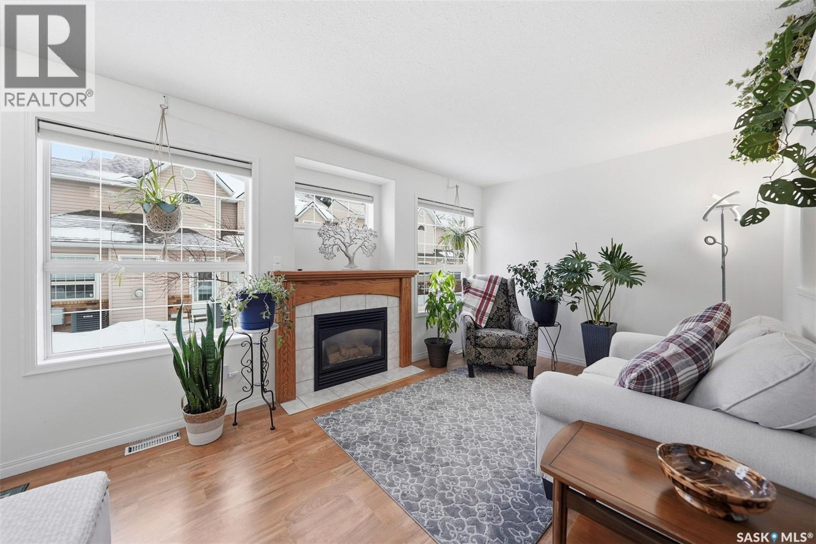 4 102 Willow Street, Saskatoon, SK - Indoor Photo Showing Living Room With Fireplace