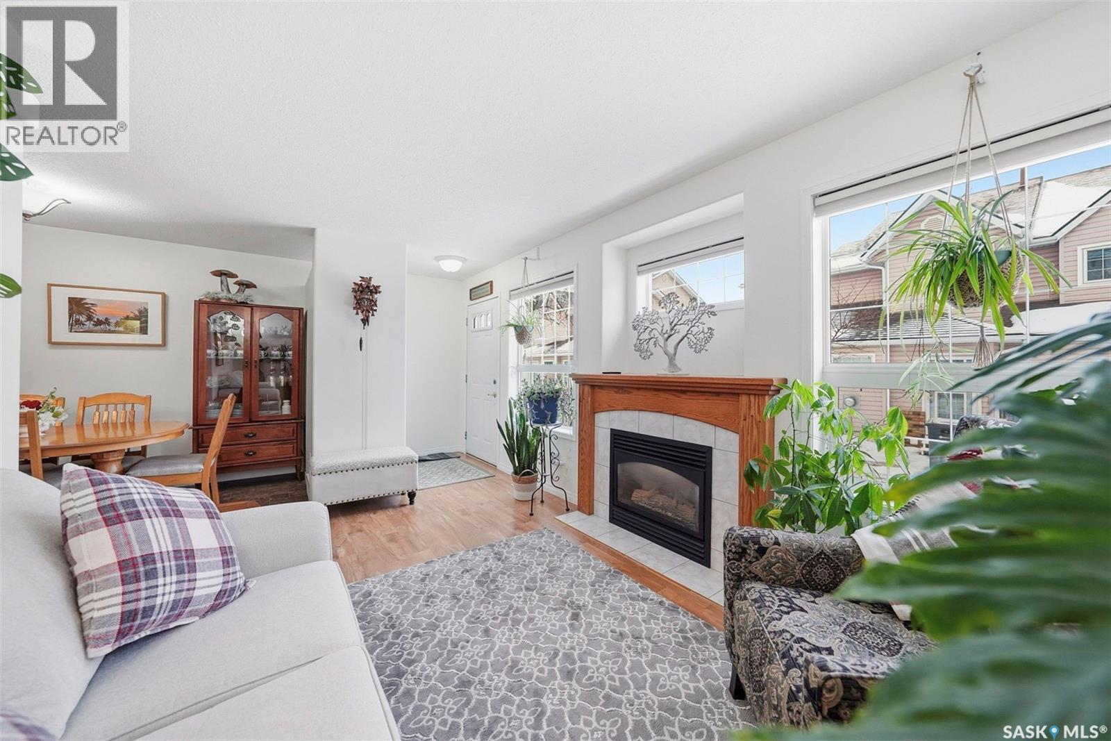 4 102 Willow Street, Saskatoon, SK - Indoor Photo Showing Living Room With Fireplace